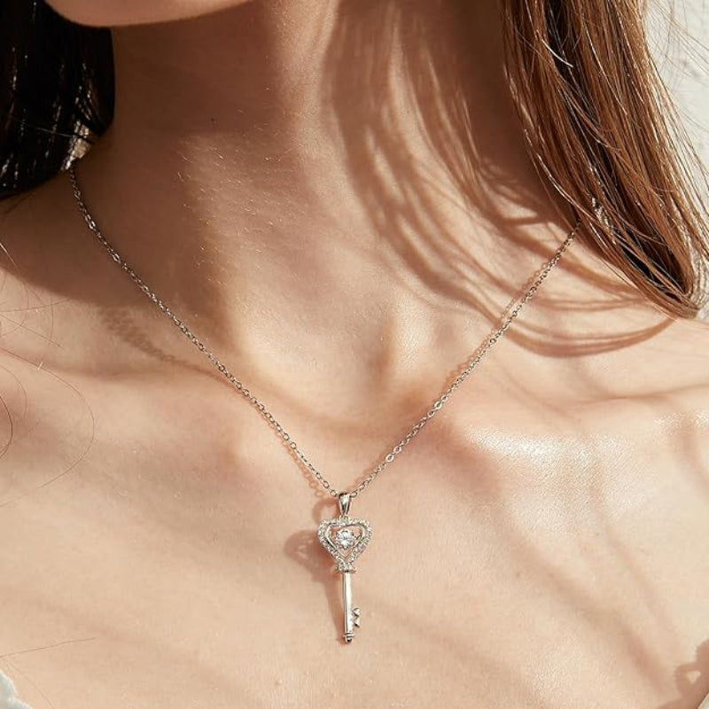 Necklace with a key-shaped pendant on a person's neck